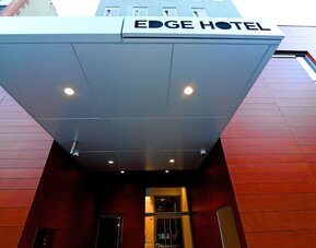 Entrance view with Edge Hotel signage and modern exterior design at Edge Hotel NYC.