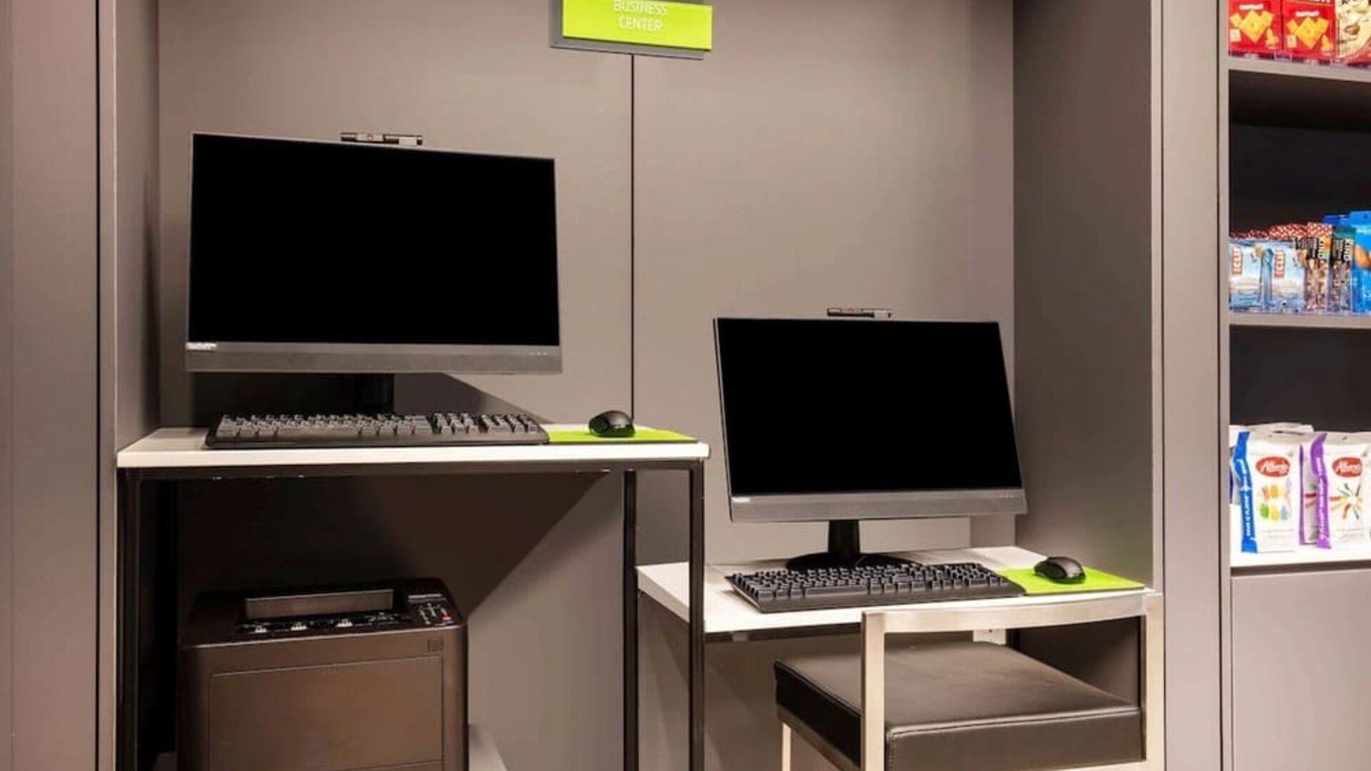 Business center with computers, workspace desks, and printer facilities at La Quinta Times Square South.