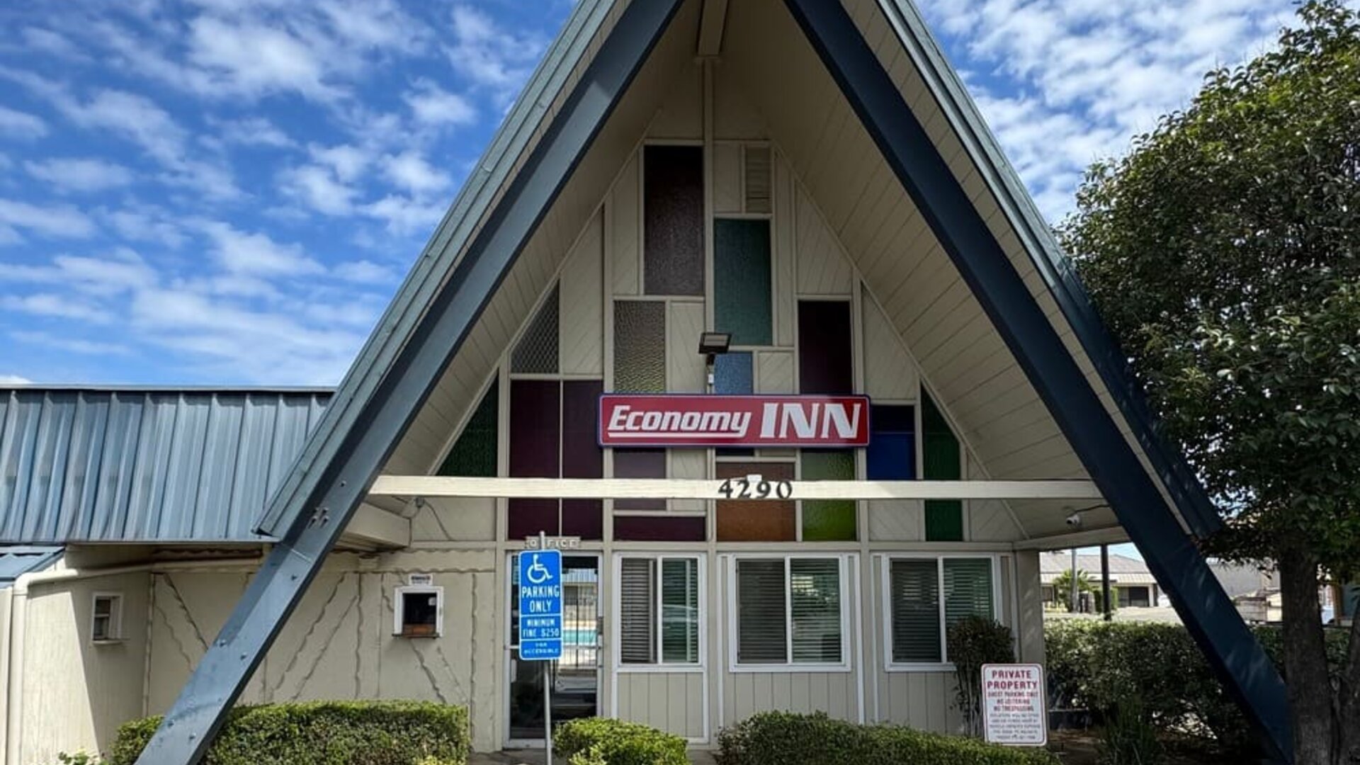 Hotel exterior at Economy Inn.