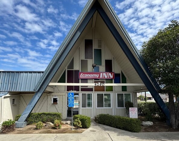 Hotel exterior at Economy Inn.