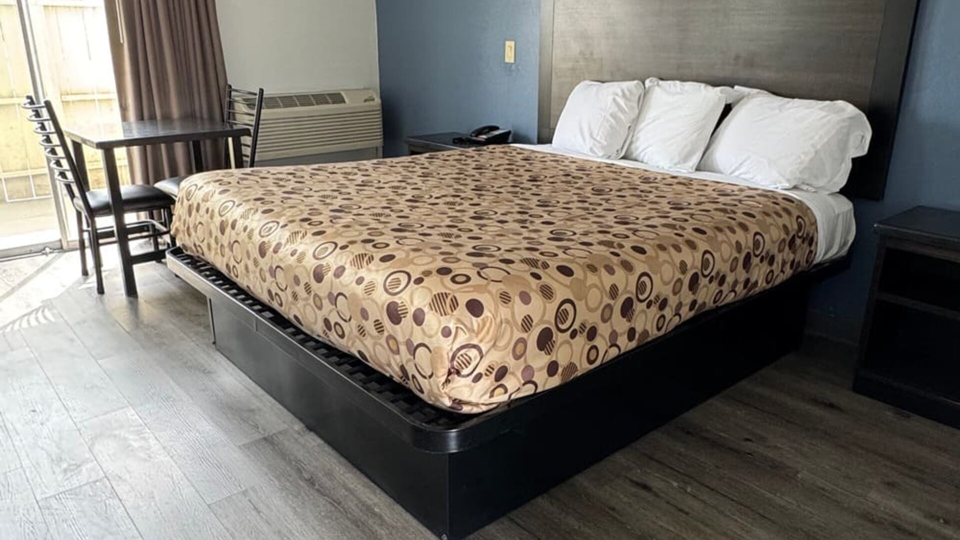 Day room with natural light and king bed at Economy Inn.