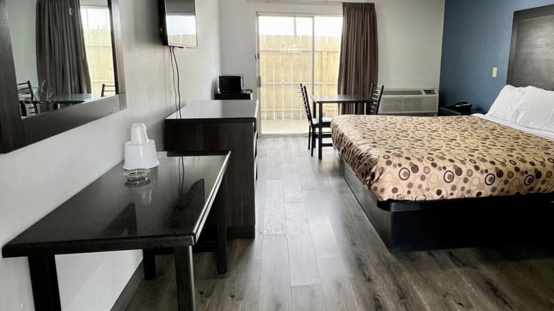 Day room with natural light and king bed at Economy Inn.