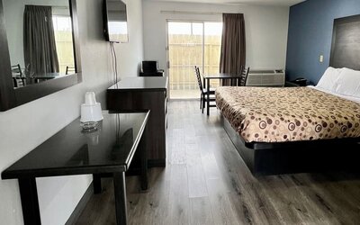 Day room with natural light and king bed at Economy Inn.