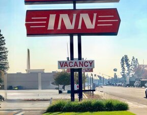 Hotel sign at Economy Inn.