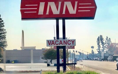 Hotel sign at Economy Inn.