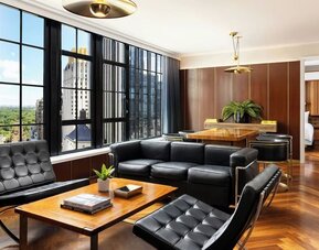 Lounge seating area with chairs and table setup at Le Méridien New York, Central Park.