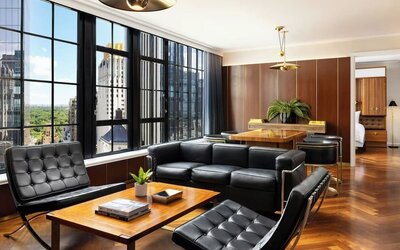 Lounge seating area with chairs and table setup at Le Méridien New York, Central Park.