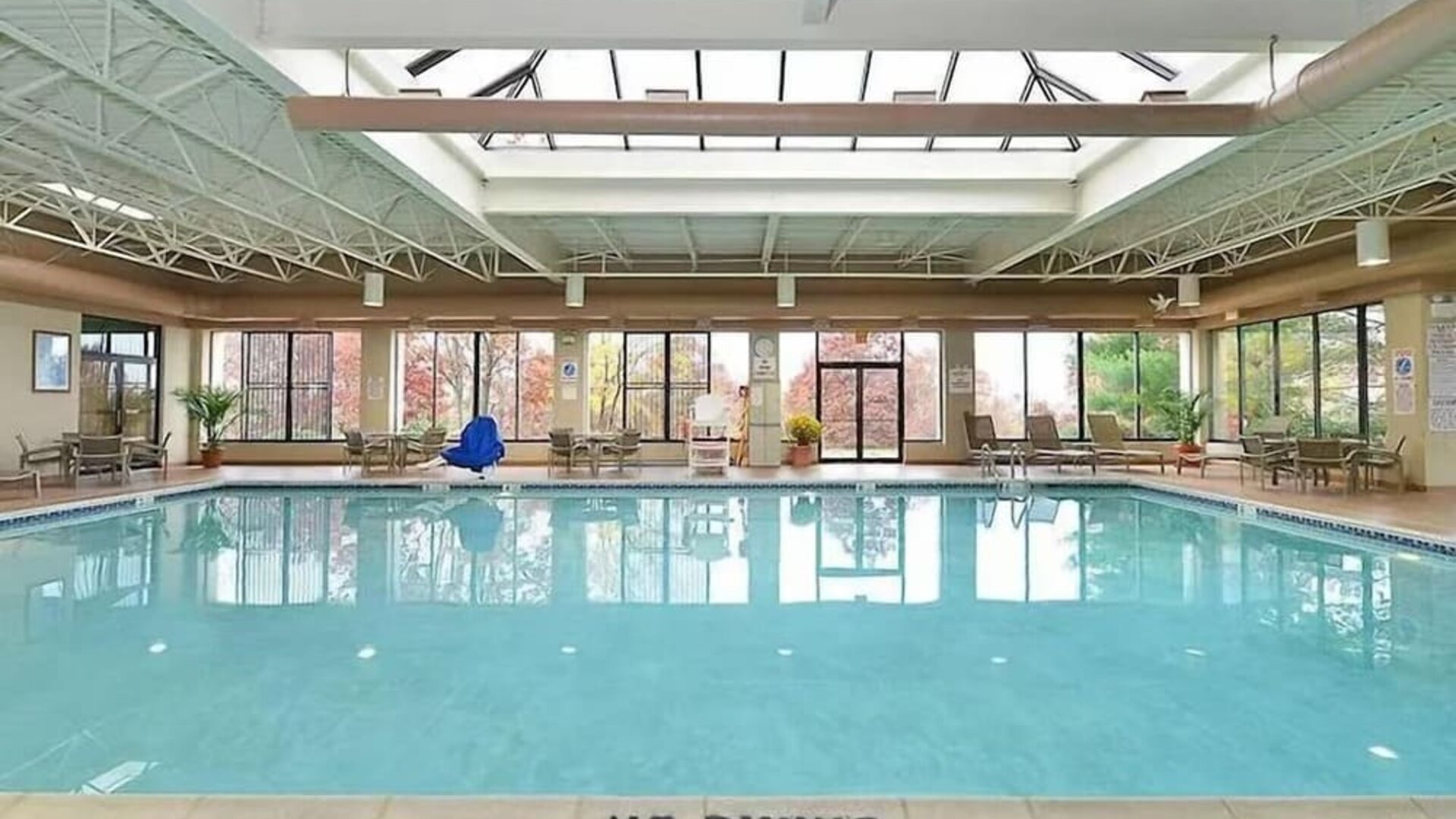 Indoor pool with natural light at DoubleTree By Hilton Wilkes-Barre.