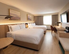 Two queen beds with work desk and natural light at DoubleTree By Hilton Wilkes-Barre.