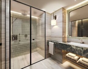 Guest bathroom with shower and basin at DoubleTree By Hilton Istanbul Macka.
