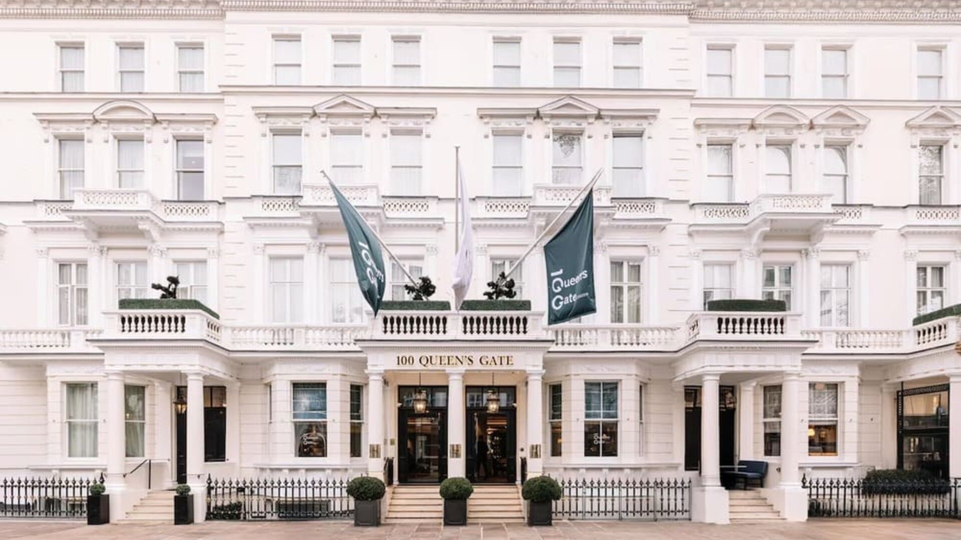 Hotel exterior with white walls at 100 Queen's Gate Hotel London.