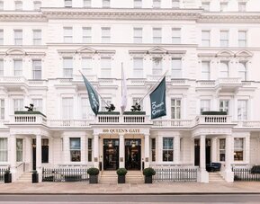 Hotel exterior with white walls at 100 Queen's Gate Hotel London.