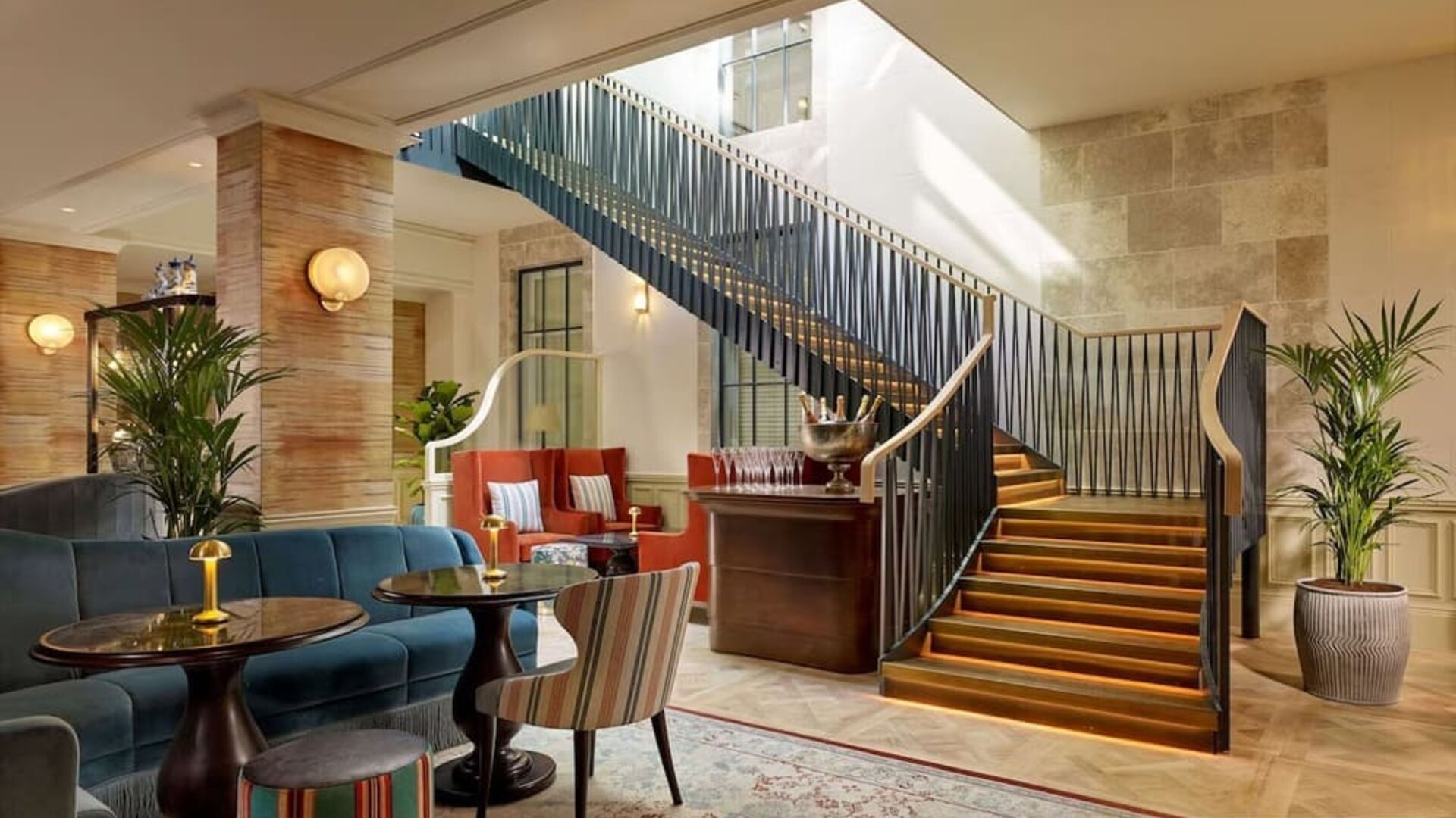 Hotel reception and stairway at 100 Queen's Gate Hotel London.