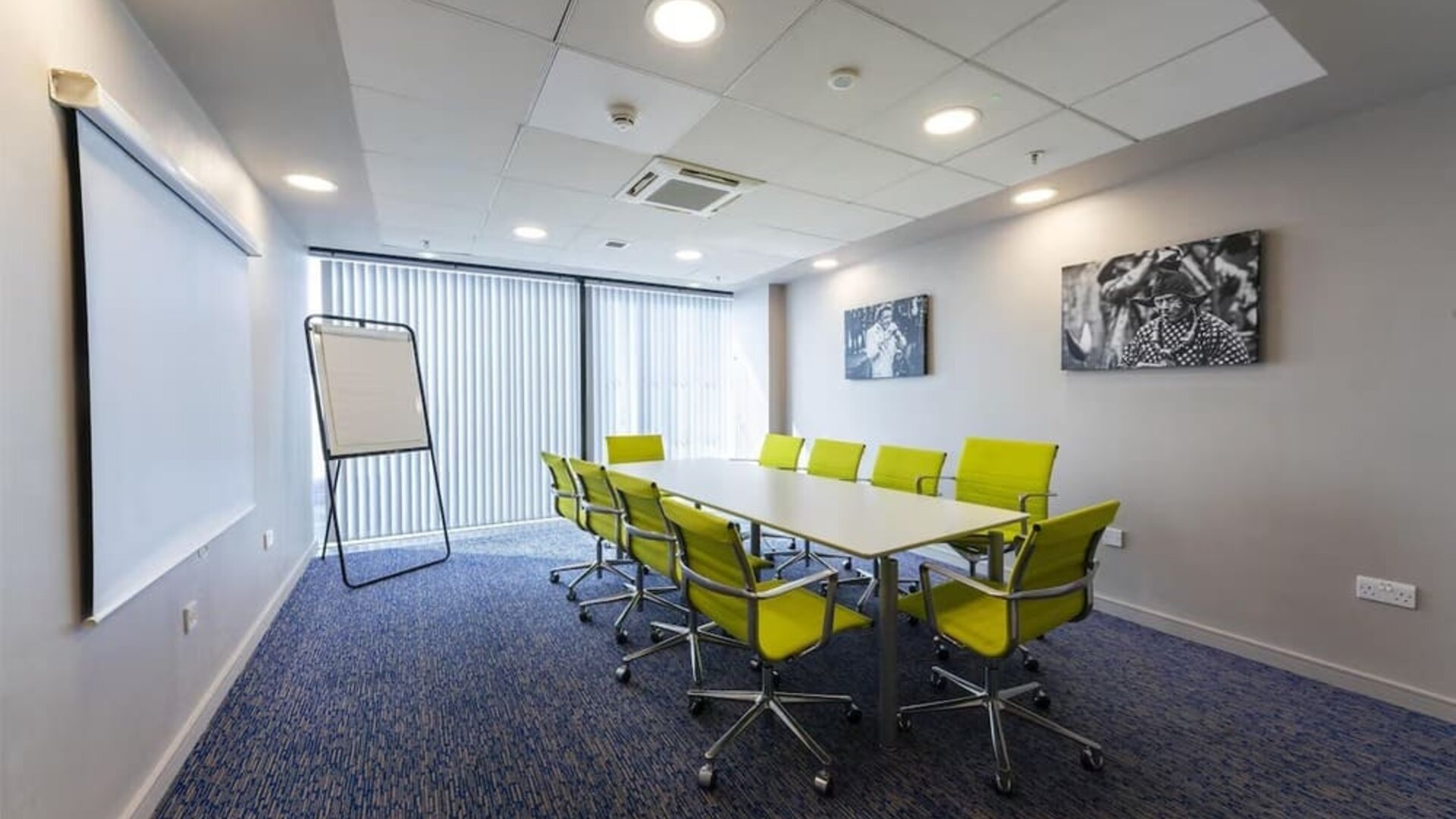Meeting room with yellow chairs at Hampton By Hilton Liverpool/John Lennon Airport.
