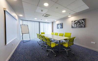 Meeting room with yellow chairs at Hampton By Hilton Liverpool/John Lennon Airport.
