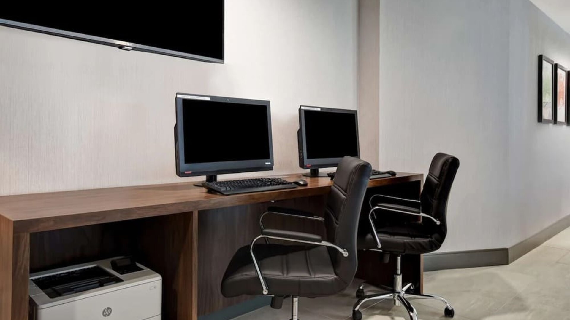 Business center with computers and printer at Hampton Inn NY-JFK.