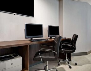 Business center with computers and printer at Hampton Inn NY-JFK.
