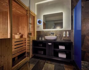 Private bathroom with shower and sauna at Haven Hotel Rotterdam.