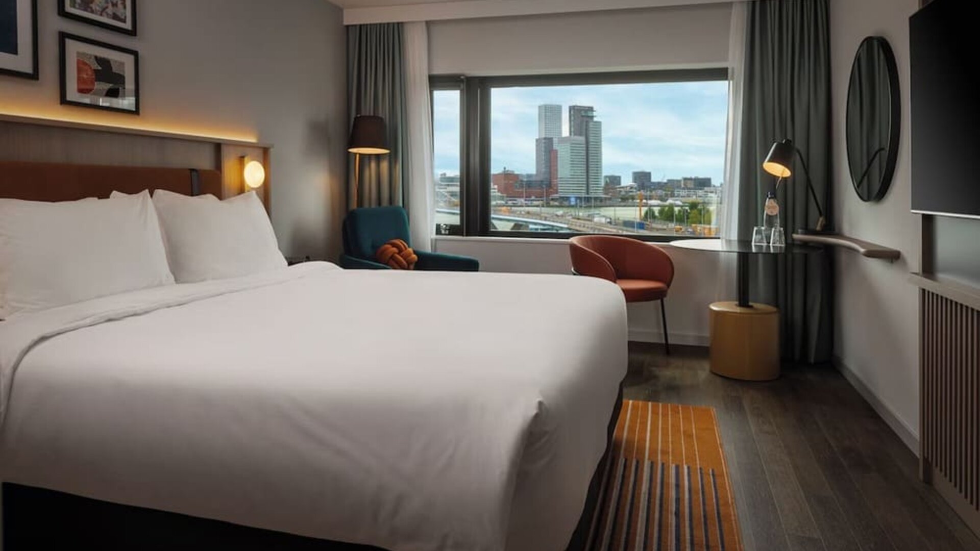 Day use room with king bed and TV at DoubleTree By Hilton Rotterdam Centre.