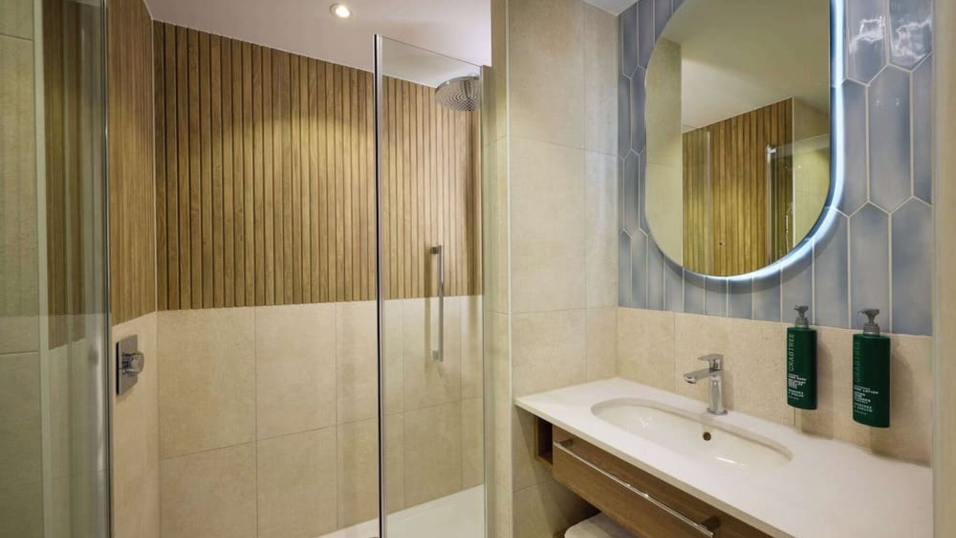 Guest bathroom with shower at DoubleTree By Hilton Rotterdam Centre.