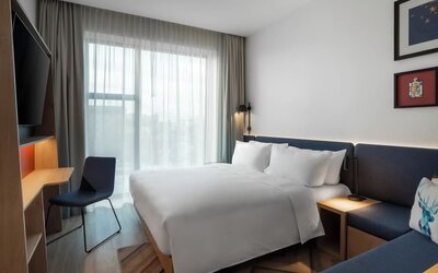 day use room with TV and work desk at Hampton By Hilton Tallinn.