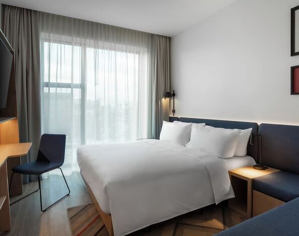 day use room with TV and work desk at Hampton By Hilton Tallinn.