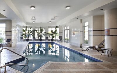 Indoor pool with natural light at Hilton Garden Inn Montreal Airport.