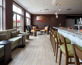 Cozy hotel bar and restaurant at Hilton Garden Inn Montreal Airport.