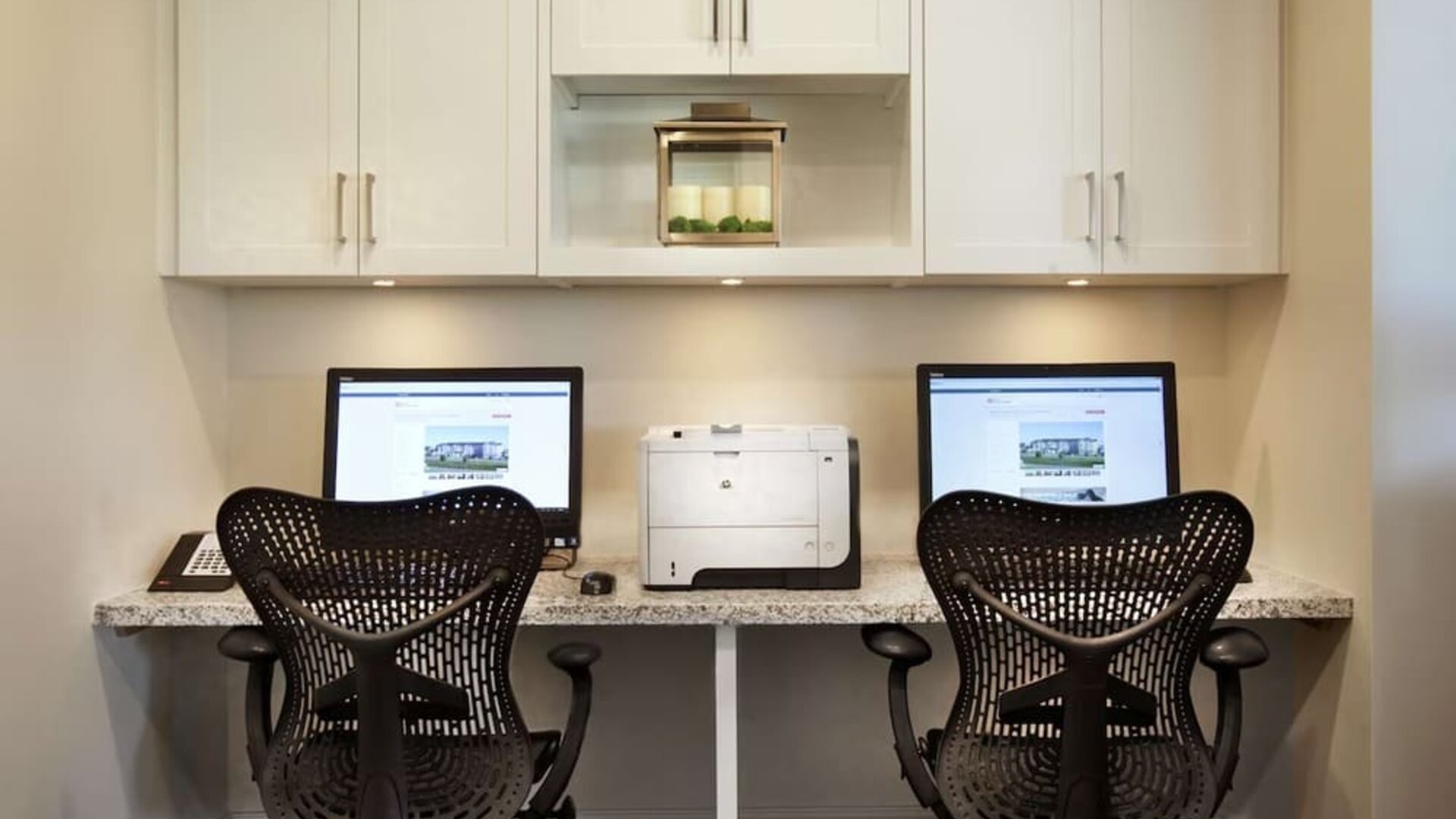 Business center with computers and printer at Hilton Garden Inn Montreal Airport.