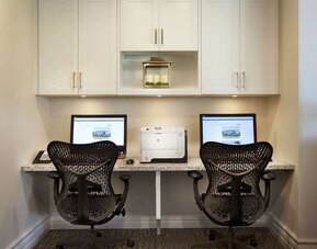 Business center with computers and printer at Hilton Garden Inn Montreal Airport.