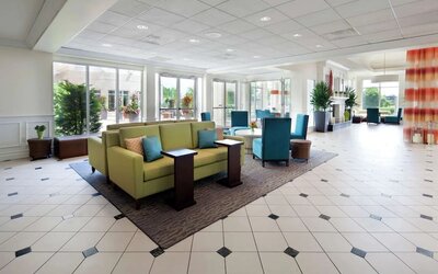 Lobby and lounge area at Hilton Garden Inn Montreal Airport.