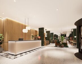 Bright reception hall with illuminated front desk, wood paneling, lounge seating, and dining area