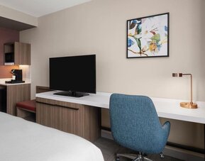 In-room workspace and television at Hilton Garden Inn New York/West 35th Street.