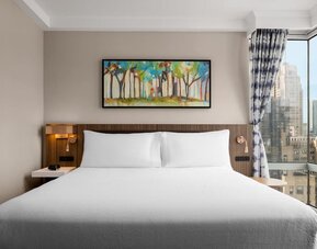 King room with skyline views at Hilton Garden Inn New York/West 35th Street.