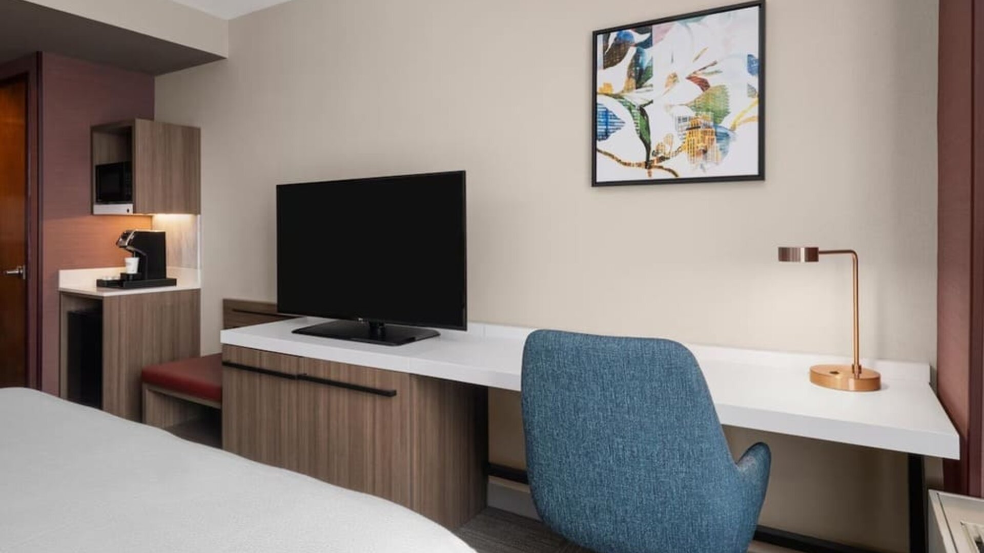 In-room workspace and television at Hilton Garden Inn New York/West 35th Street.