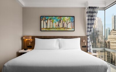 King room with skyline views at Hilton Garden Inn New York/West 35th Street.