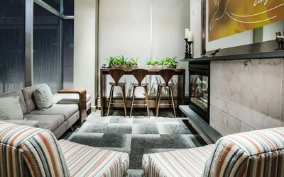 Cozy lobby lounge with fireplace at Hilton Garden Inn New York/West 35th Street.