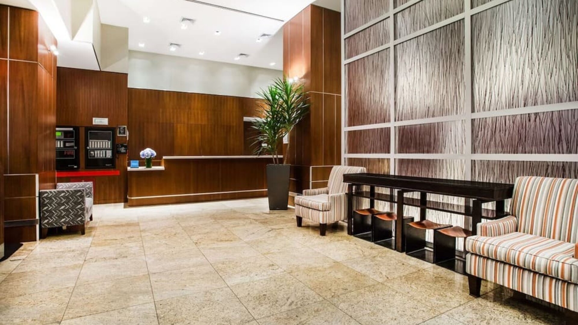 Spacious hotel lobby with seating at Hilton Garden Inn New York/West 35th Street.
