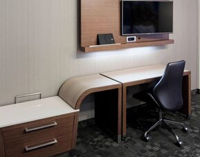 In-room workspace with desk and television at Courtyard By Marriott Houston North/Shenandoah.