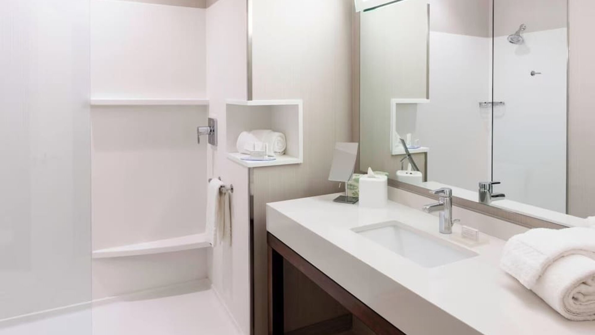 Modern accessible bathroom with walk-in shower at Courtyard By Marriott Houston North/Shenandoah.
