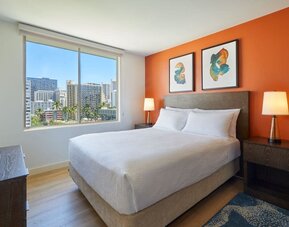 King guest room with city views at Courtyard Waikiki Beach.