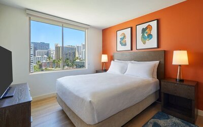 King guest room with city views at Courtyard Waikiki Beach.