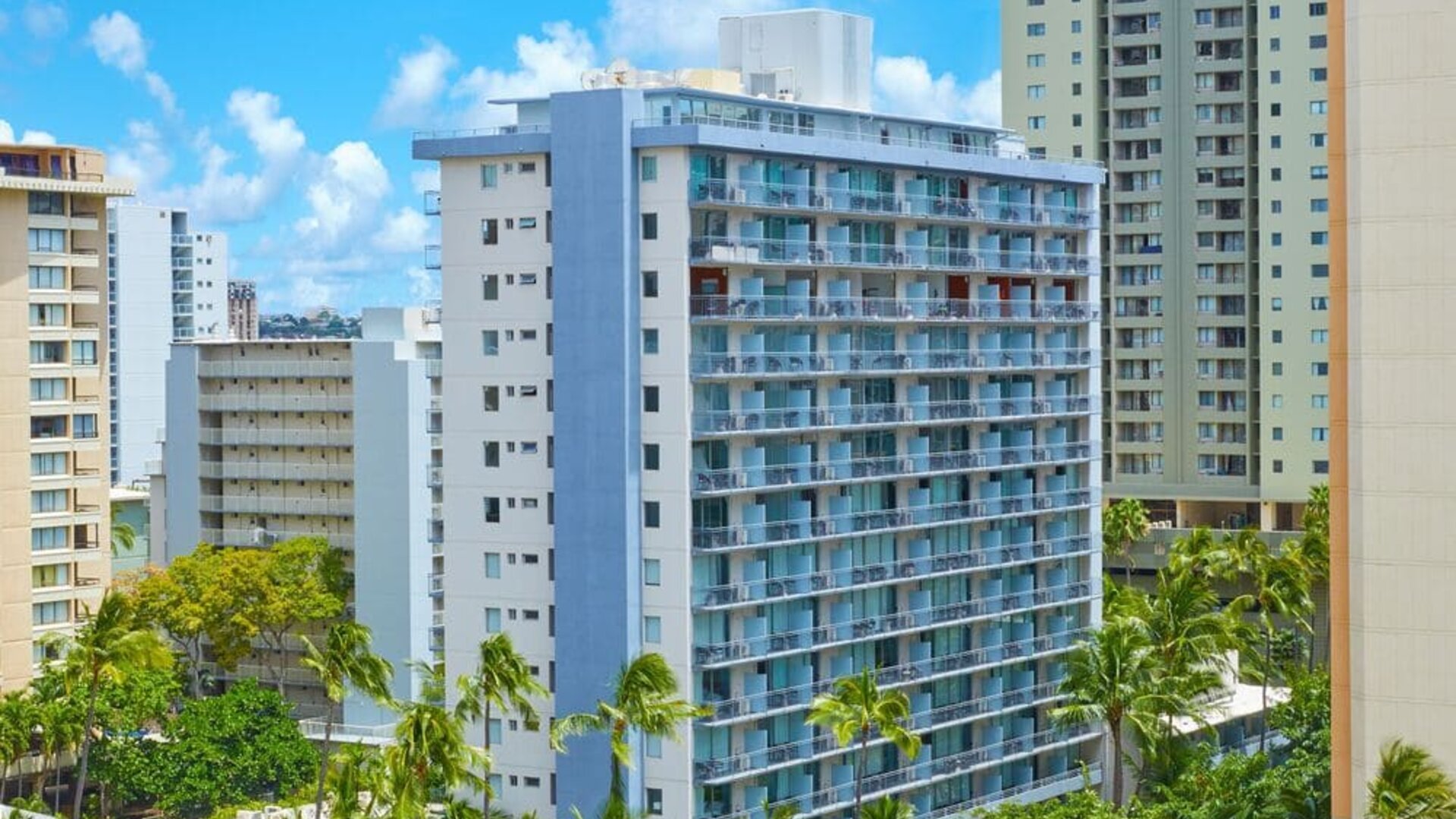Exterior view of Courtyard Waikiki Beach hotel building.