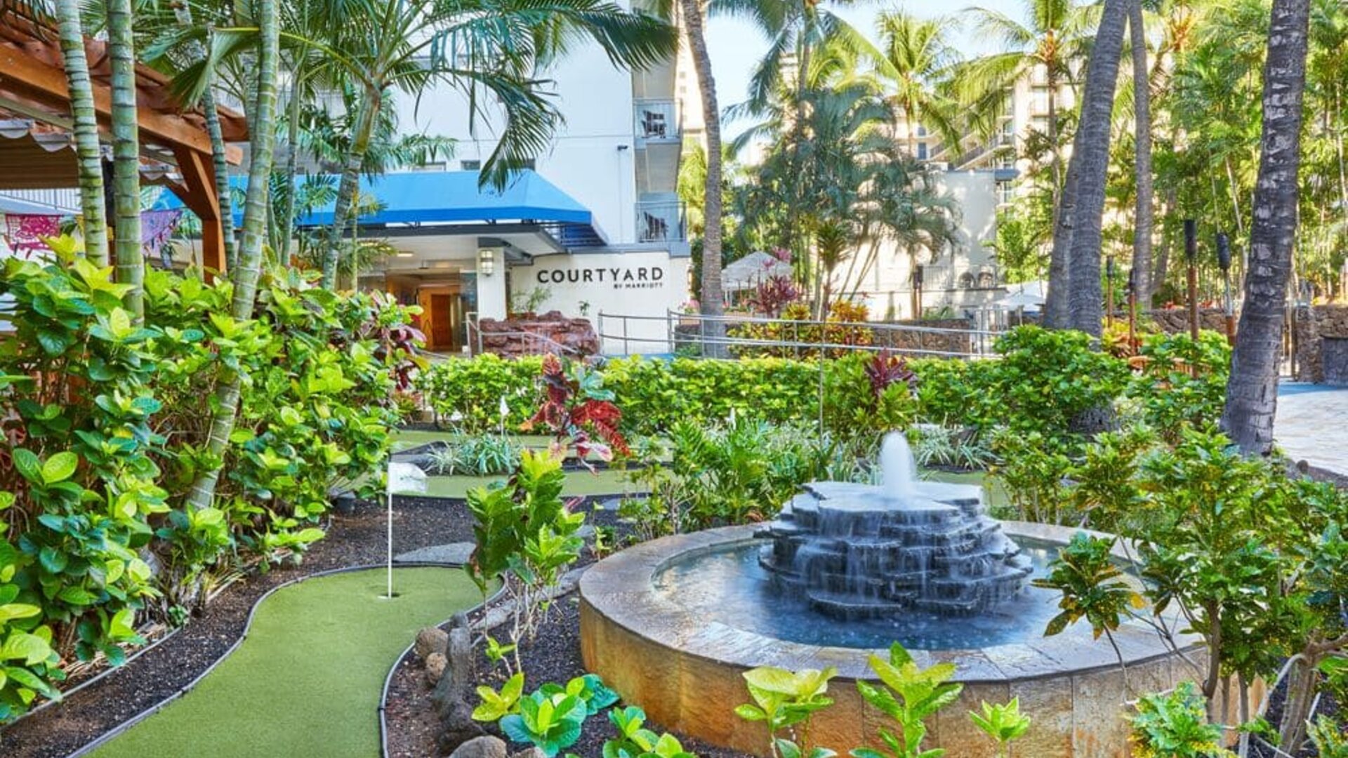 Tropical garden fountain area at Courtyard Waikiki Beach.