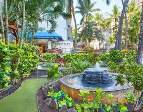 Tropical garden fountain area at Courtyard Waikiki Beach.