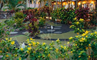 Lush mini golf garden area at Courtyard Waikiki Beach.