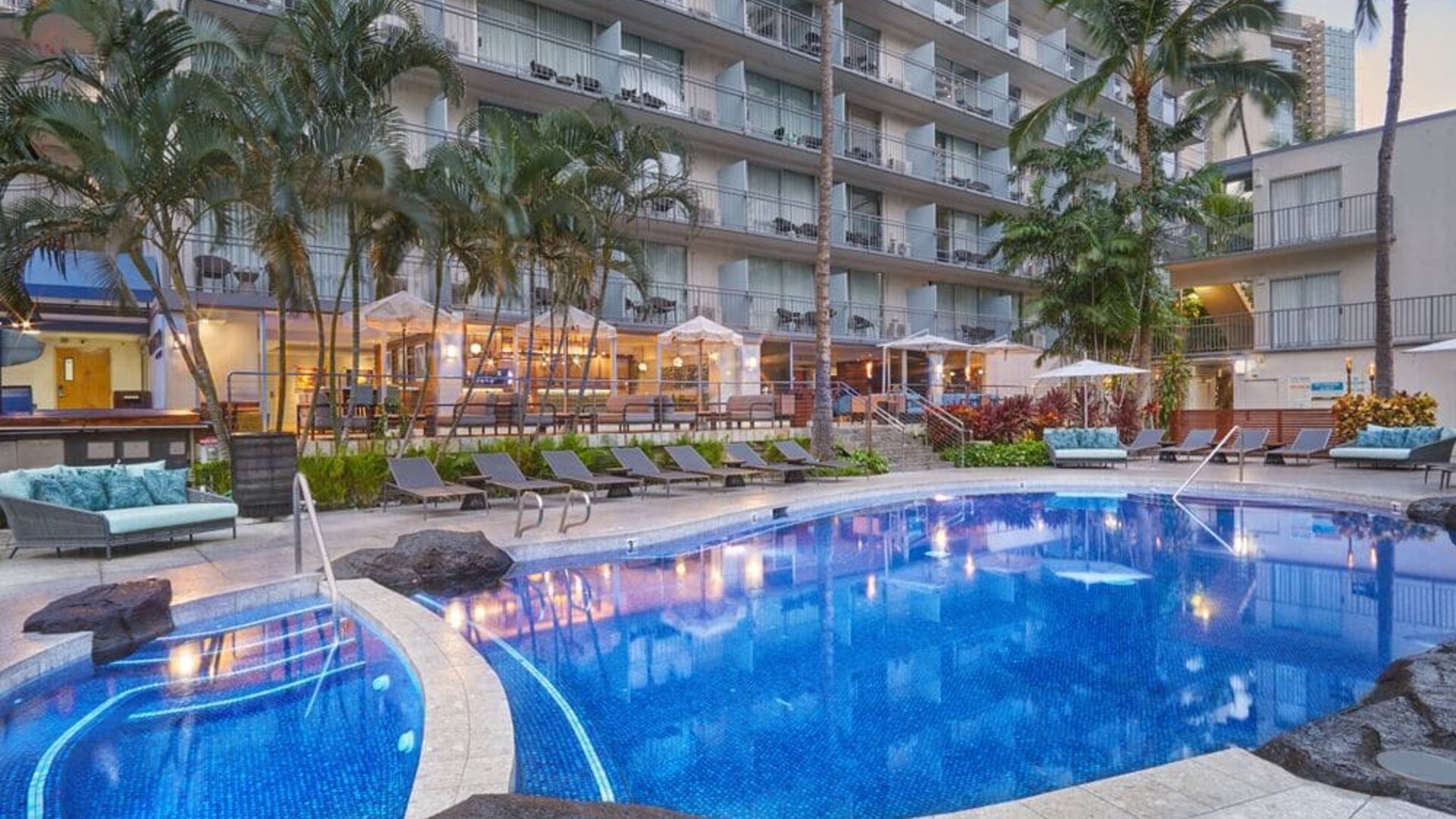 Resort-style outdoor pool area at Courtyard Waikiki Beach.