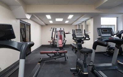 Fitness center with cardio machines and strength equipment at Hotel Montreal Metropolitan, An Ascend Collection Hotel.