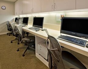 Business center with desktop computers and workstations at Hilton Garden Inn New York Central Park South-Midtown West.