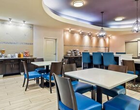Bright dining area with breakfast seating at La Quinta Inn & Suites By Wyndham Houston Energy Corridor.